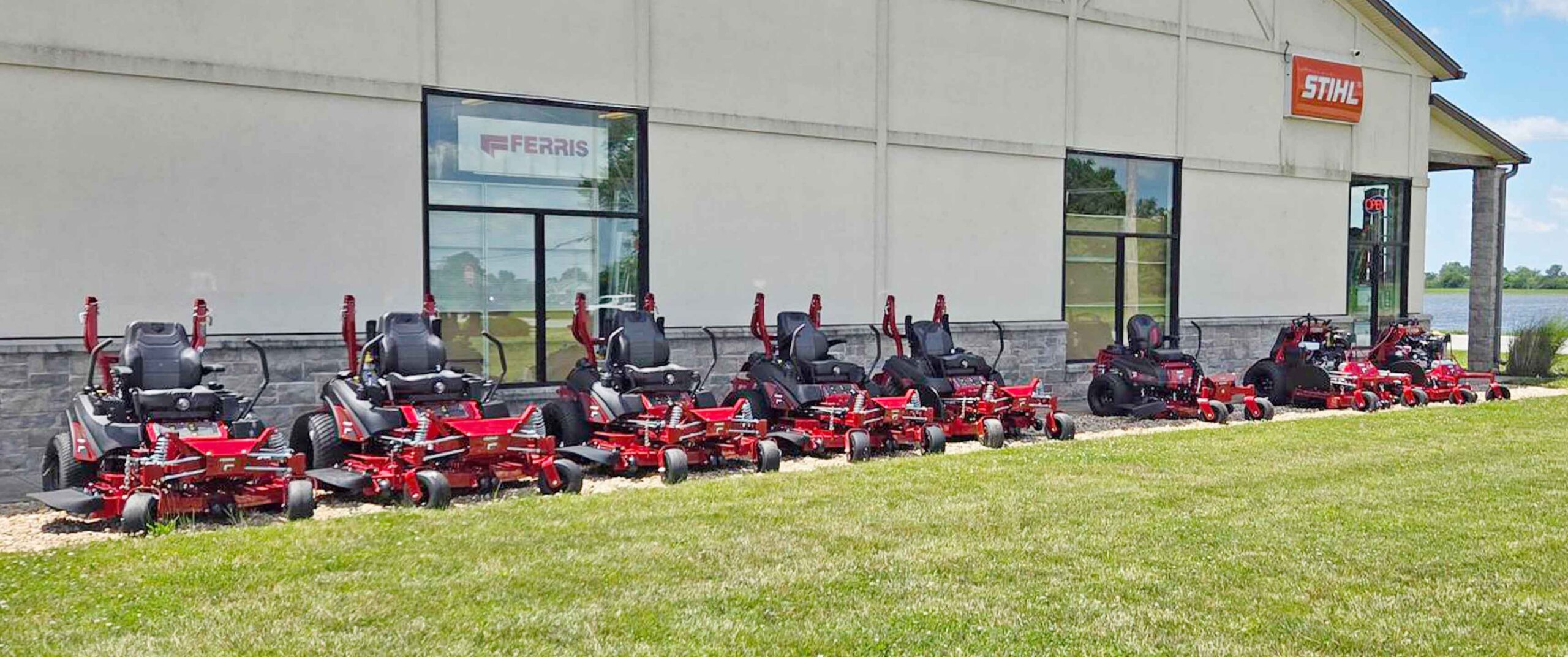 lawn mowers lined up in a row