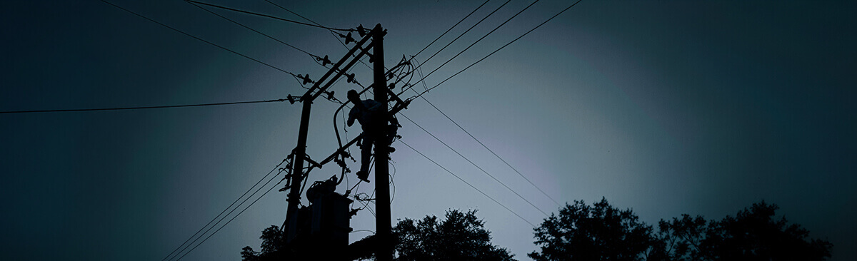 Central Indiana utility technicians work on power lines to return electricity to homes without whole-house generators after an outage