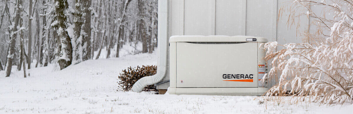 A whole-home backup generator on the side of a home in the suburbs of Greenwood, Indiana, after a snowfall