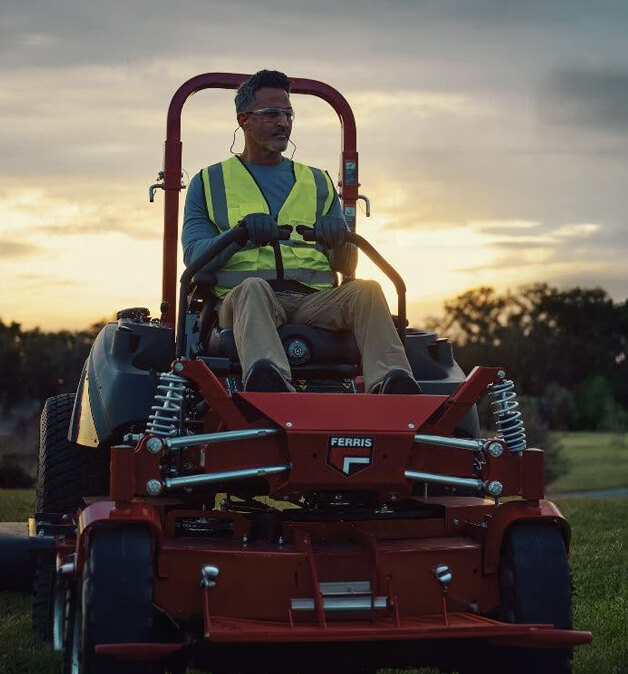 Man riding a commercial ZTR Ferris mower